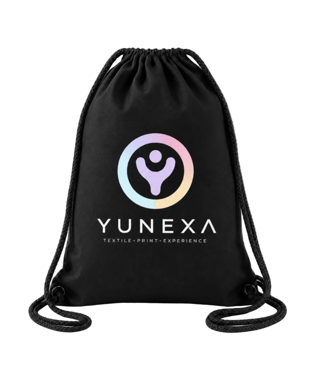 A black drawstring bag with the YUNEXA logo printed on the front, featuring a pastel rainbow gradient circle with a stylized figure and white text reading 'YUNEXA' and 'TEXTILE • PRINT • EXPERIENCE'.