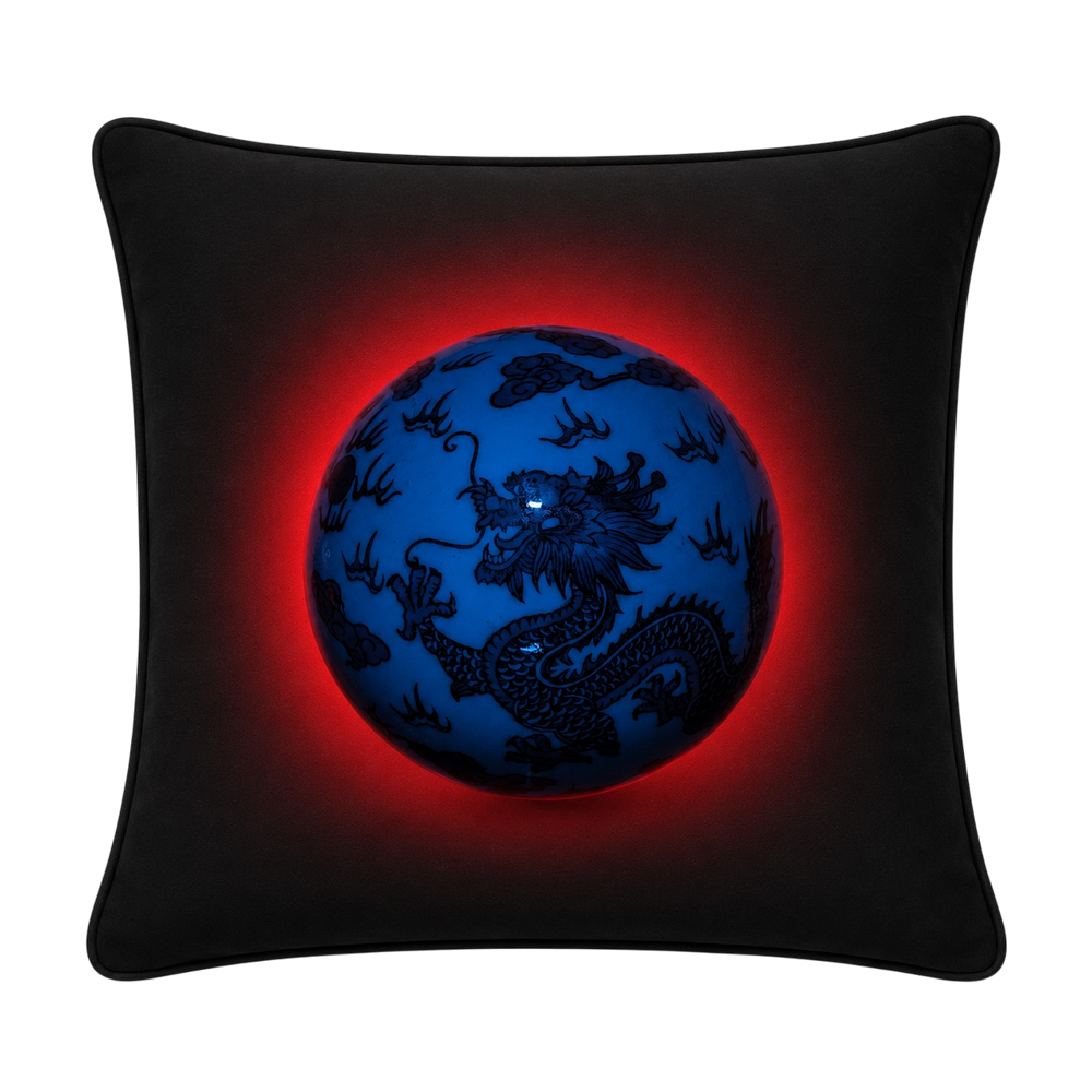A square black throw cushion featuring a printed graphic of a glowing blue globe with a black dragon design and a red aura effect, shown against a plain white background.