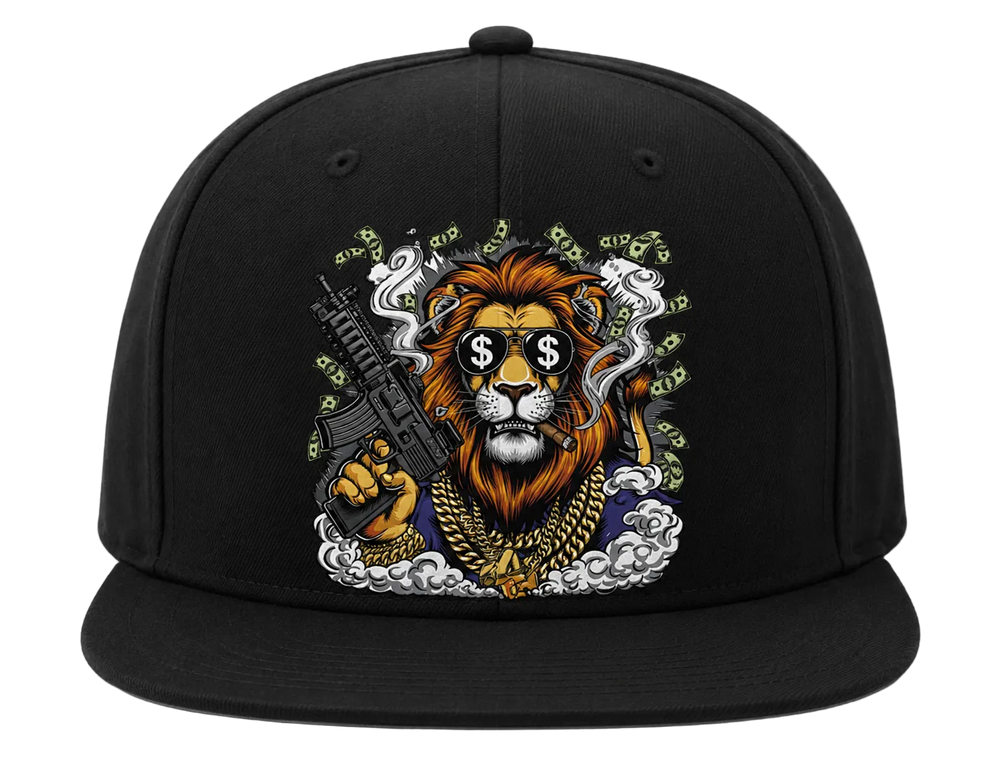 A black flat-brim baseball cap featuring a detailed graphic print of a lion wearing a gold chain and sunglasses with dollar signs, holding a rifle, surrounded by money bags and smoke.