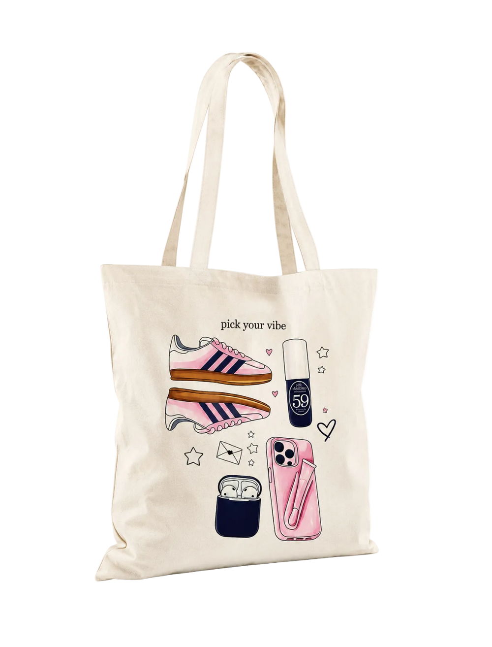 A cream-colored canvas tote bag with long shoulder straps, featuring a watercolor-style graphic print of pink sneakers, a pink phone case, a navy lip gloss tube labeled '59', earbuds in a case, and the text 'pick your vibe'.