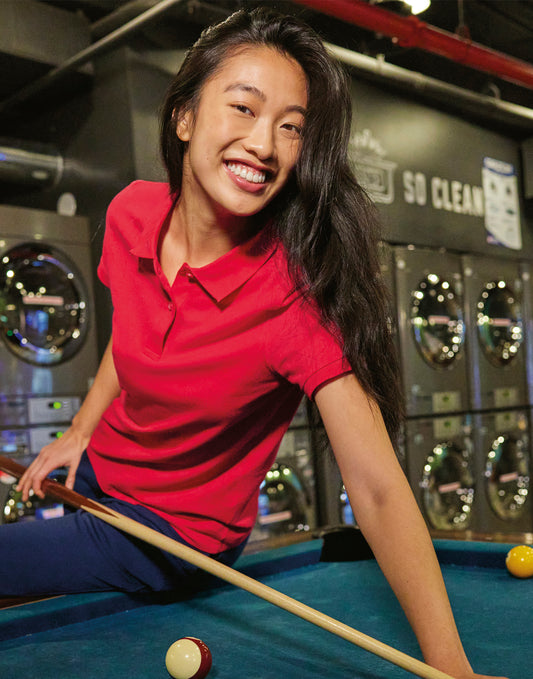 Women's eco polo shirt 65/35 worn by a model