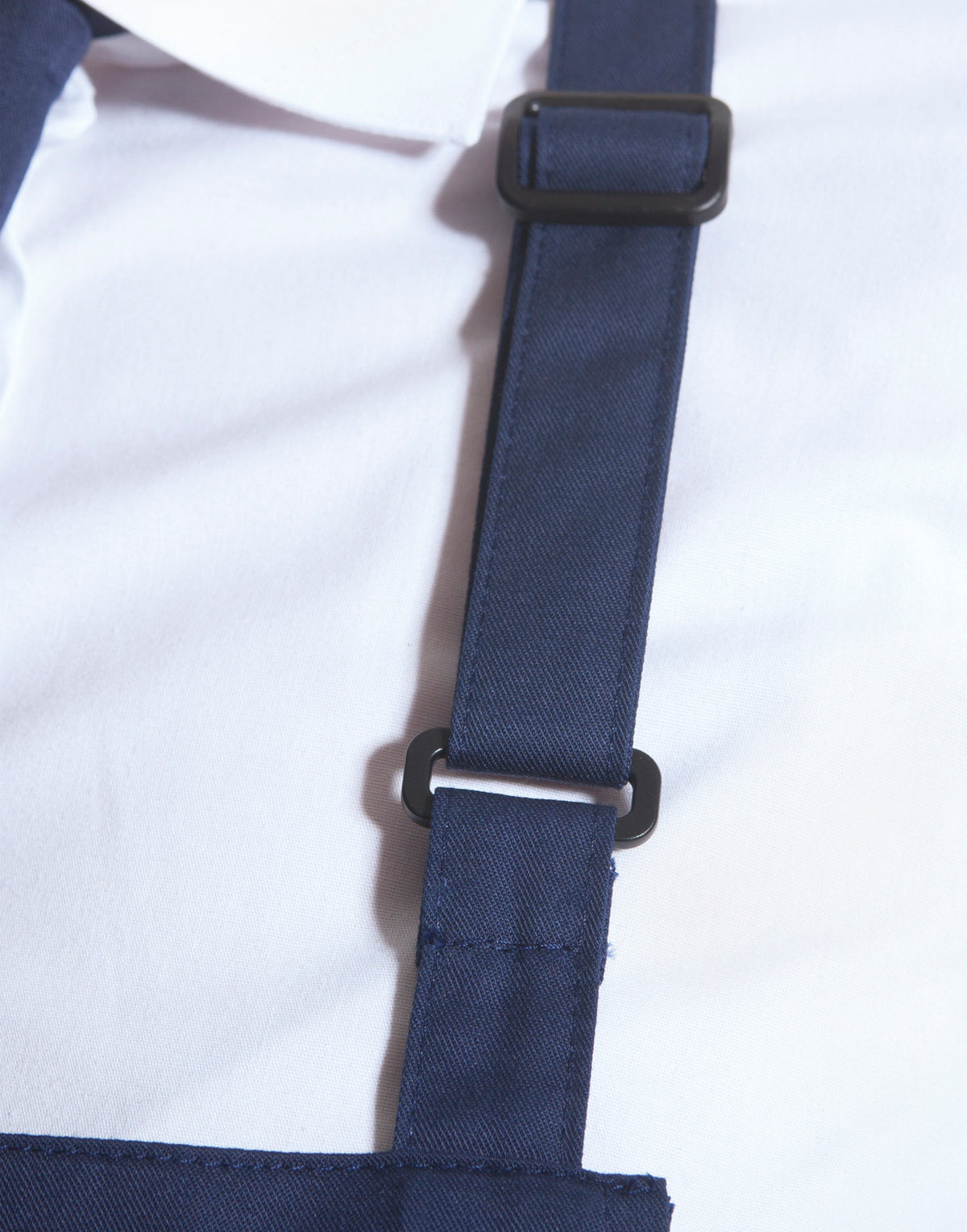 Custom bib apron, fabric and neck buckle detail