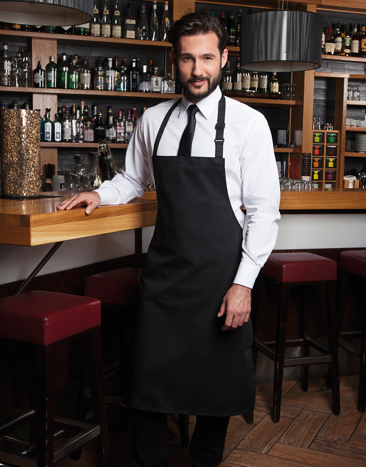 Custom bib apron in Black, worn