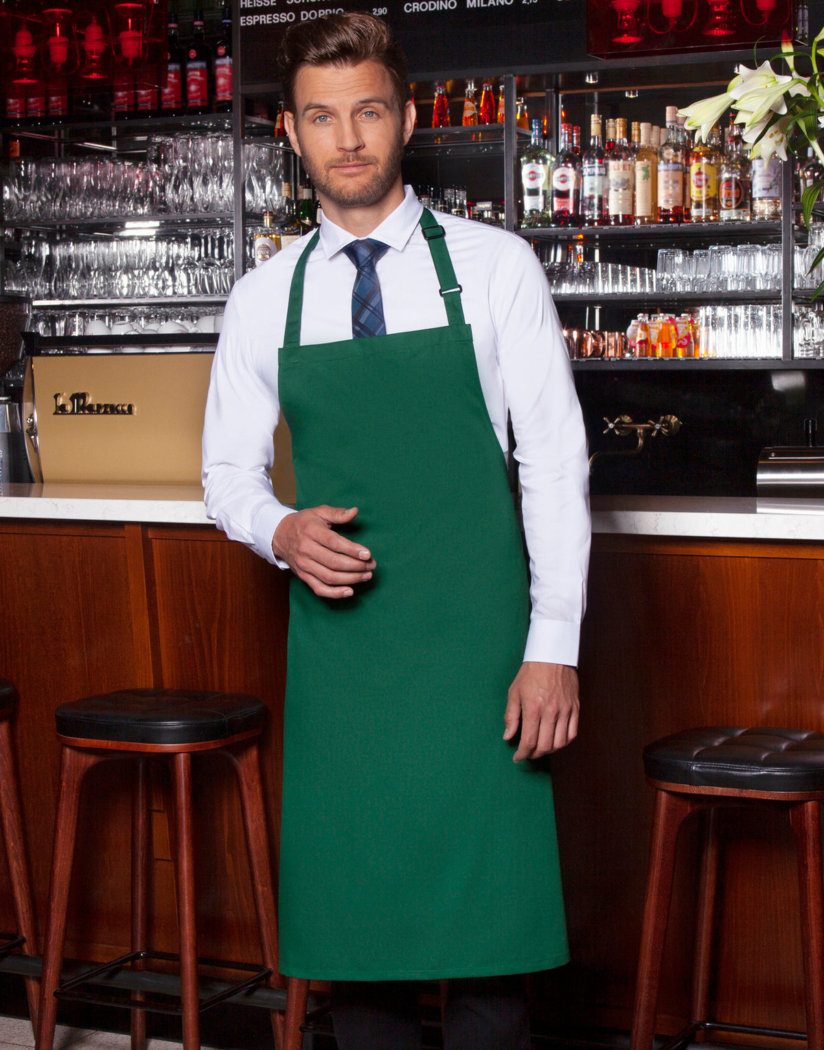 Custom bib apron in Forest Green, worn
