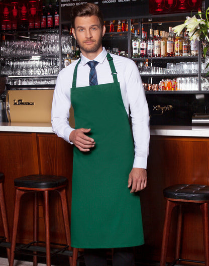 Custom bib apron in Forest Green, worn
