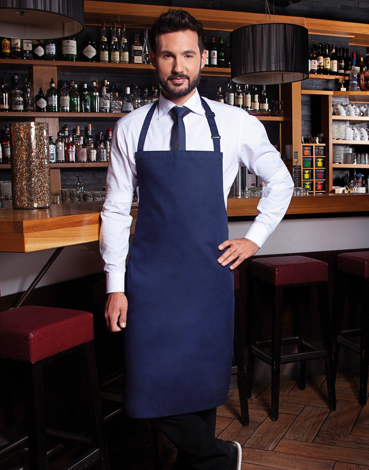 Custom bib apron in Navy, worn