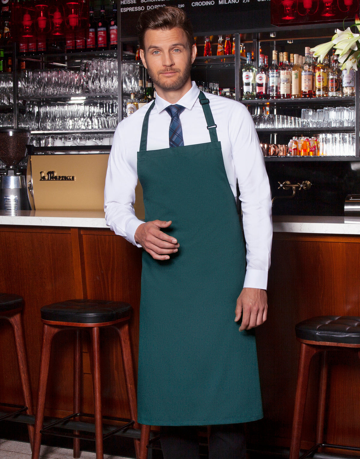 Custom bib apron in Pine Green, worn