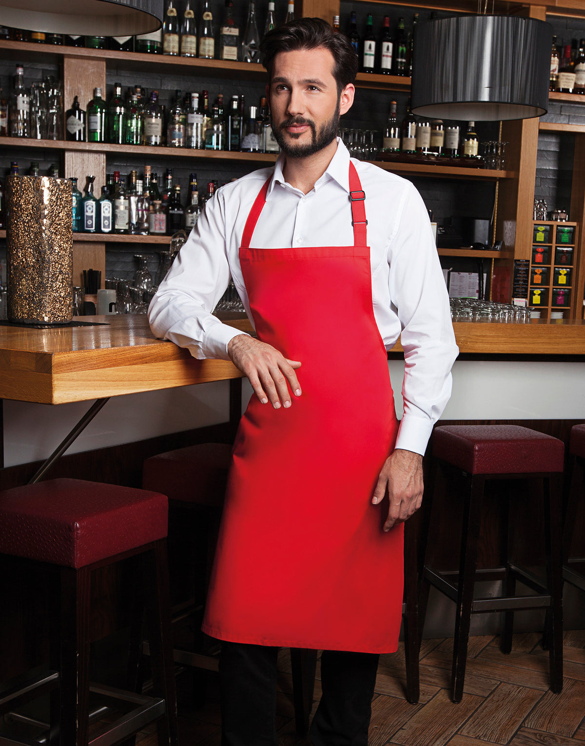 Custom bib apron in Red, worn
