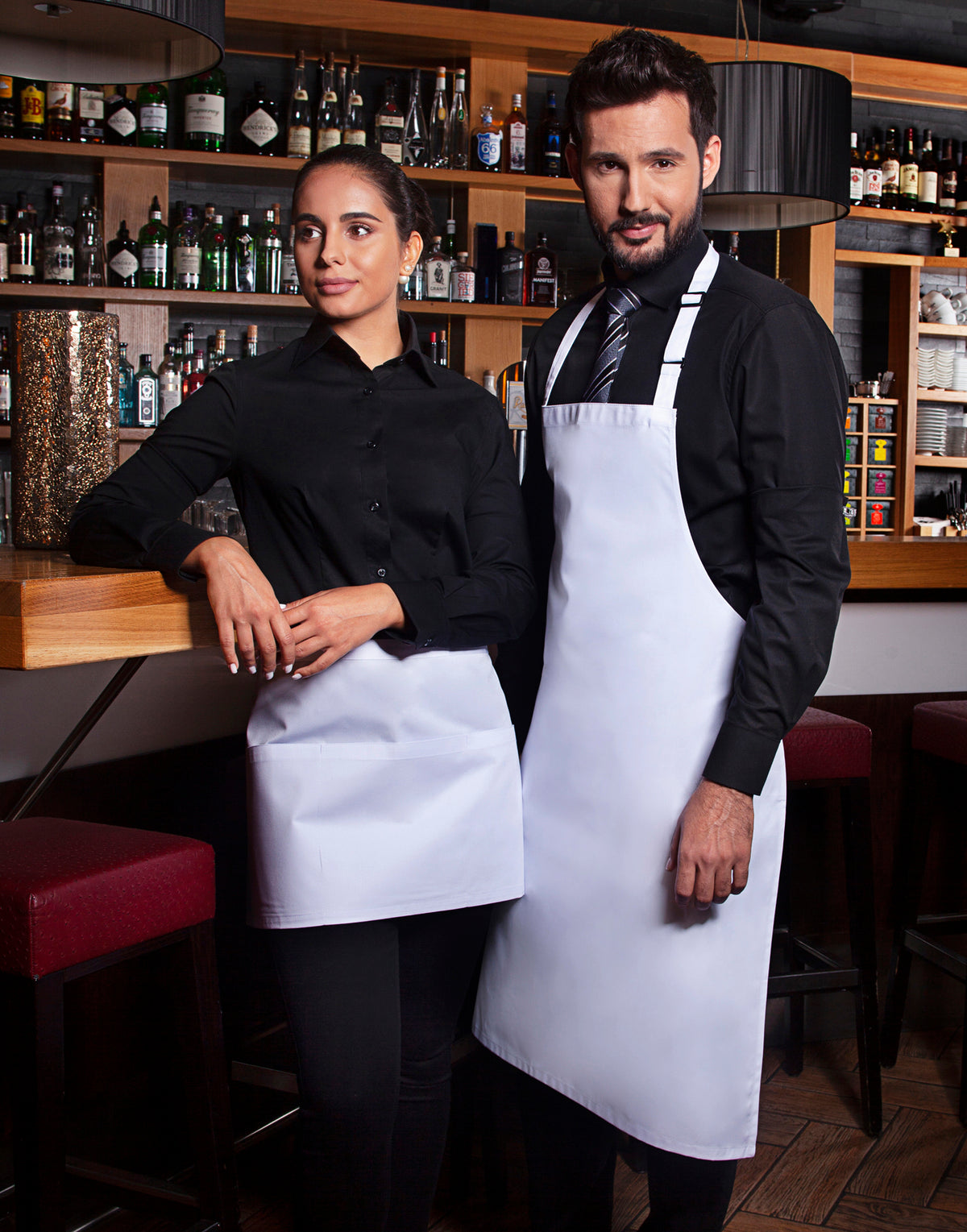 Custom bib apron in White, worn in a professional kitchen
